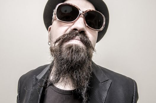 long beard and mustache hipster with elegant suit 