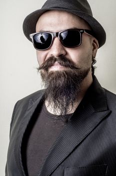 long beard and mustache hipster with elegant suit 