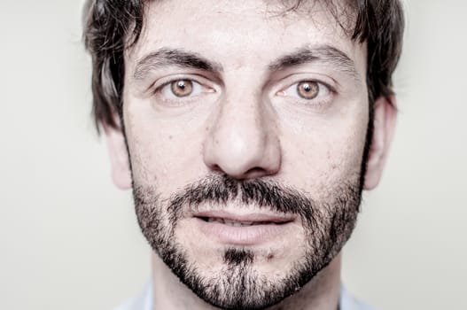 closeup portrait of bearded man on white background