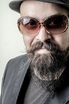 long beard and mustache hipster with elegant suit 