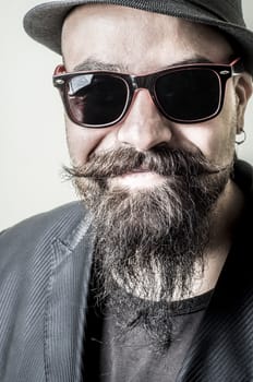 long beard and mustache hipster with elegant suit 