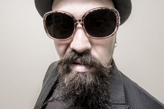 long beard and mustache hipster with elegant suit 