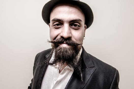 long beard and mustache hipster with elegant suit 