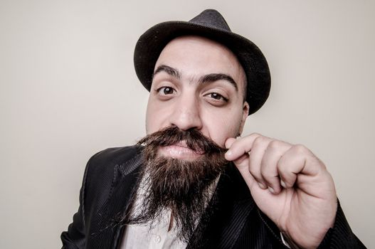 long beard and mustache hipster with elegant suit 