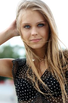 Beautiful young blonde woman. Outdoor portrait