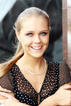 Beautiful young blonde woman. Outdoor portrait