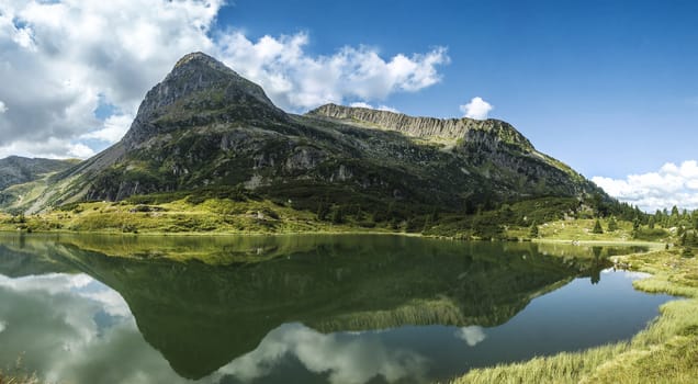 view of the lake Colbricon near the Rolle pass, Dolomites - Italy