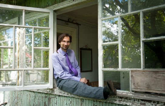 thinking Manager in the glasses in the old house