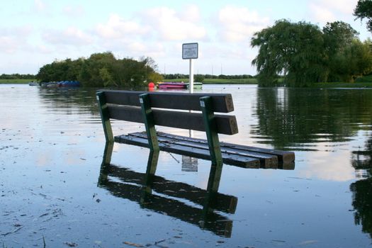 Beautiful photo with Bench underwater due to flooding
