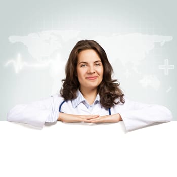 Young attractive female doctor put her hands on the blank banner, place for text