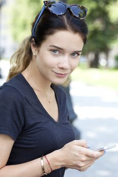 Young woman reading a message on the phone