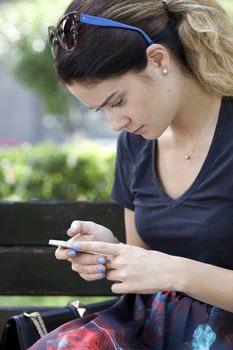 Young woman reading a message on the phone