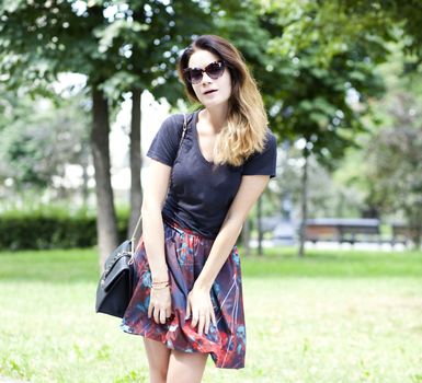 Young woman on the summer park