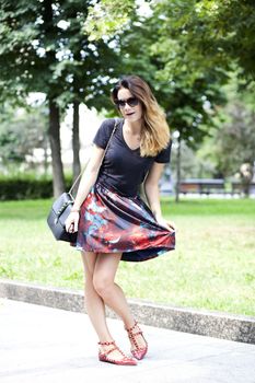 Young woman on the summer park
