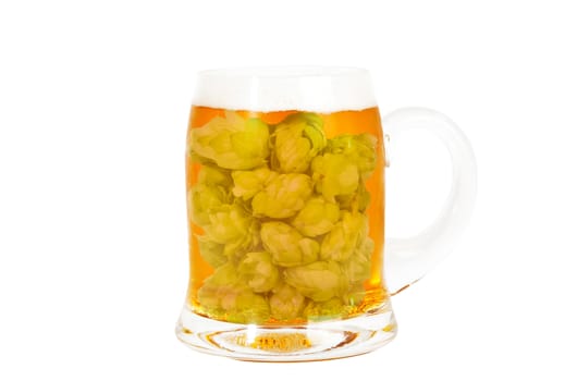 Glass of golden beer full of hop