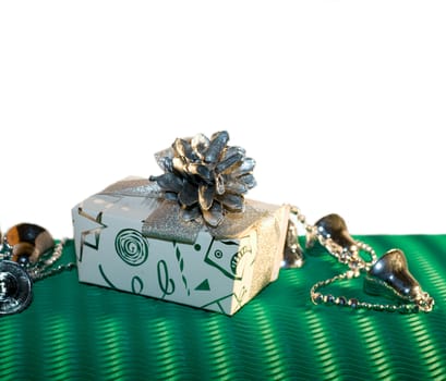 box with cone and garland on gree background