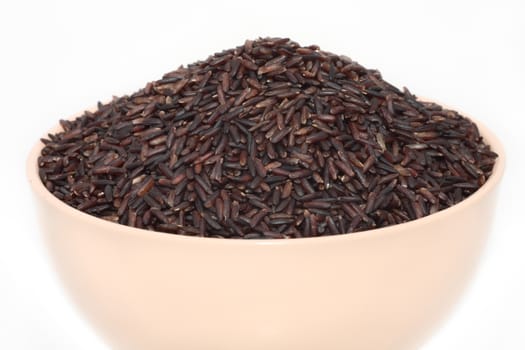 Wild brown rice in  bowl isolated white background 