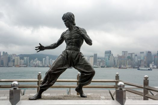 HONG KONG - MAY 16 : Bruce Lee statue on the Avenue of Stars on May 16, 2013 in Tsim Sha Tsui, Hong Kong. The statue is one of the main attractions on the famous waterfront promenade.