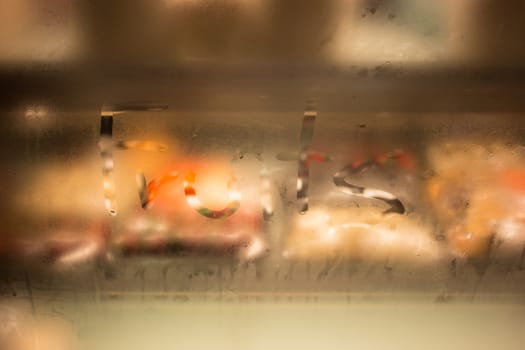 fruit word in front of glass cabinet spell fruits