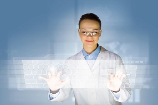 Image of young woman scientist touching icon of media screen