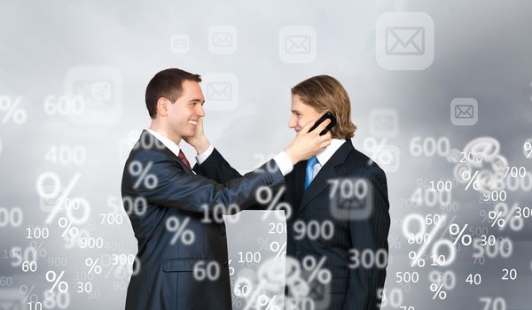 Two businessmen talking on mobile phone. Cooperation concept