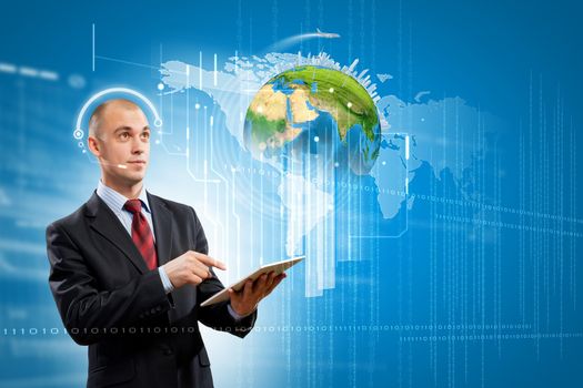 Image of businessman with tablet pc. Elements of this image are furnished by NASA