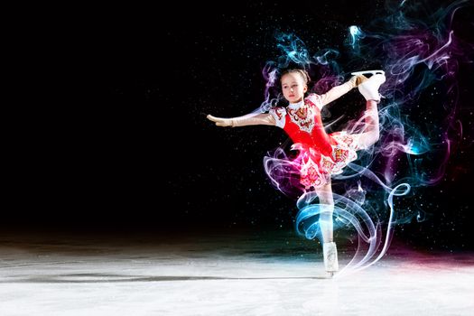 Little girl figure skating at sports arena