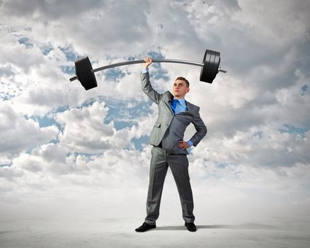 Image of strong businessman lifting barbell above head with one hand