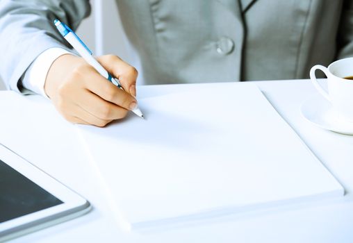 Close up image of businesswoman hands signing documents