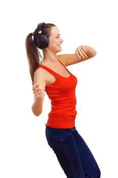 Happy smiling girl dancing and listening to music