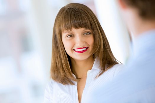 Image of attractive successful businesswoman in business suit smiling