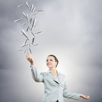 Image of businesswoman holding exclamation marks in hand