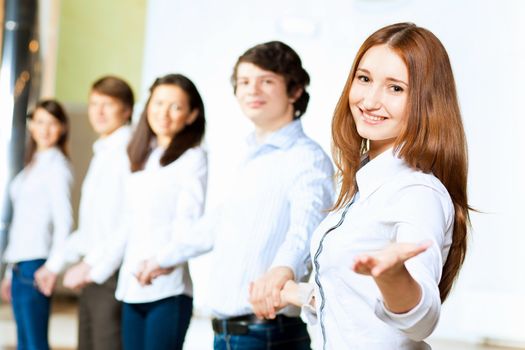 Image of five students in casual wear standing in row