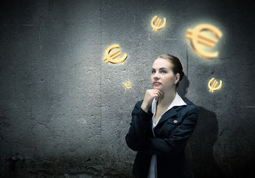 Image of concentrated businesswoman looking at euro symbol