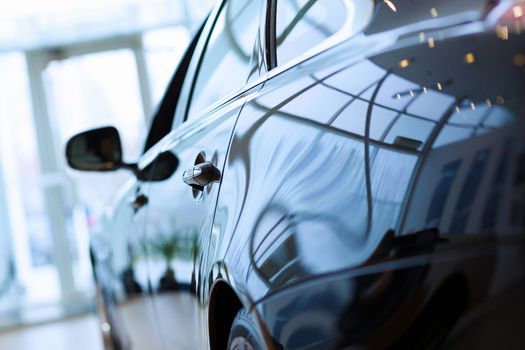 Back view of automobile in sales salon