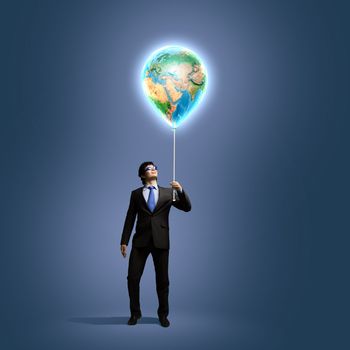 Image of businessman in goggles holding globe. Protect planet. Elements of this image are furnished by NASA