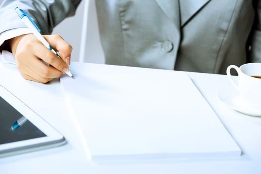 Close up image of businesswoman hands signing documents