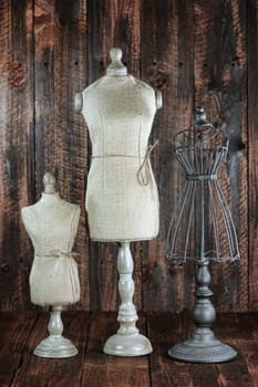 Vintage Antique Mannequin Busts on Wood Grunge Background