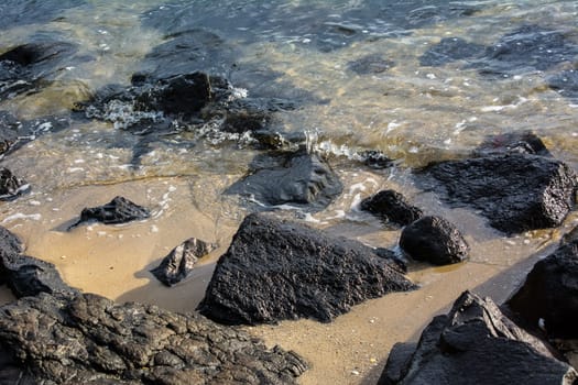 rocks near water at the beach