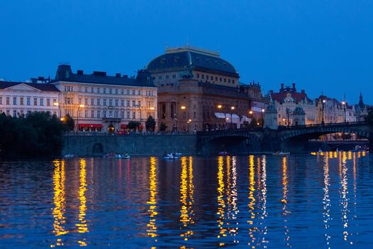 Prague, view of theater and Vltava Embankment in the evening