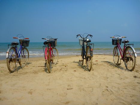 Bikes on the  beach at sunday in Myanmar