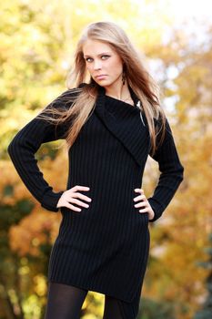 Beautiful young woman in autumn park