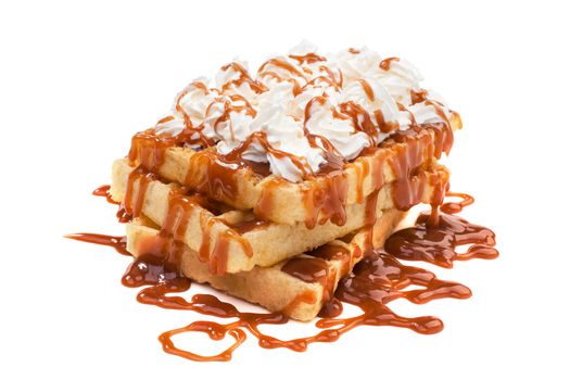 Belgian waffels under the caramel topping with cream on top