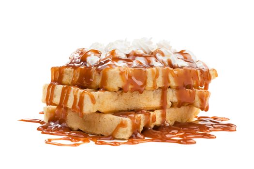 Belgian waffels under the caramel topping with cream on top