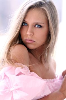 Beautiful young girl in pink dress