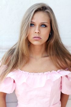 Beautiful young girl in pink dress