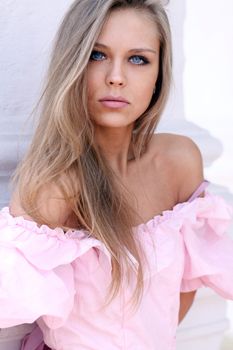 Beautiful young girl in pink dress