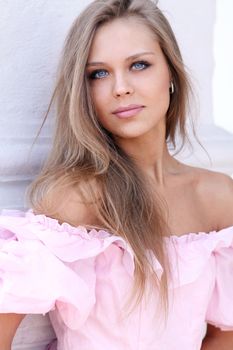 Beautiful young girl in pink dress