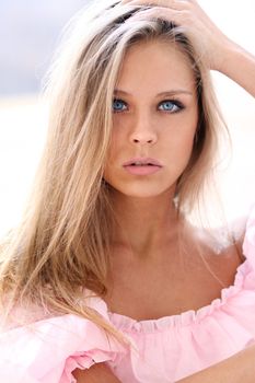 Beautiful young girl in pink dress