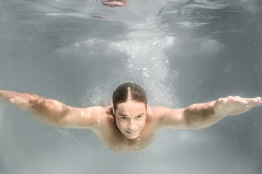 An image of a man diving in a pool